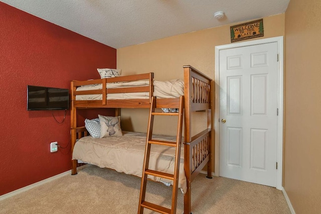 1007 Rocky Shore Ter, Kimberling City, MO 65686 - bedroom with baseboards, carpet flooring, and a textured ceiling