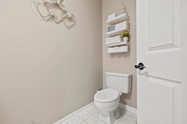 bathroom featuring tile patterned flooring and toilet