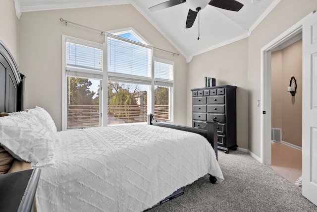 carpeted bedroom featuring ceiling fan, lofted ceiling, and ornamental molding