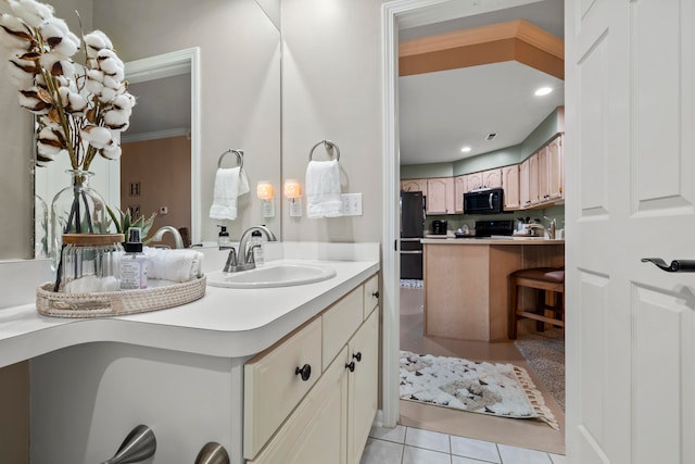 bathroom with ornamental molding, tile patterned floors, and sink