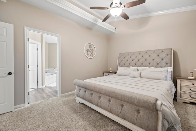 bedroom featuring light carpet, crown molding, ensuite bathroom, and ceiling fan