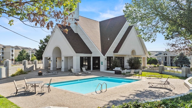 view of swimming pool featuring outdoor lounge area and a patio