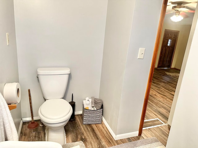 bathroom with ceiling fan, hardwood / wood-style floors, and toilet