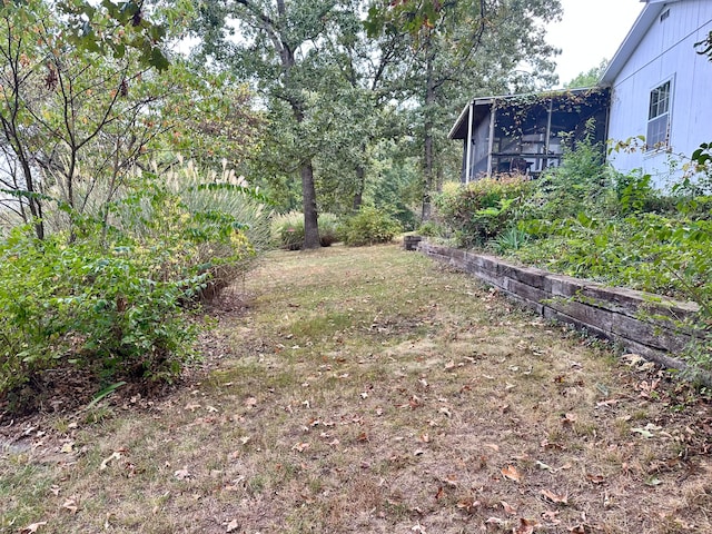 view of yard with a sunroom