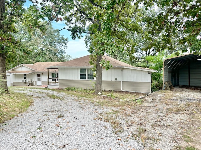 view of front of house featuring a carport and covered porch