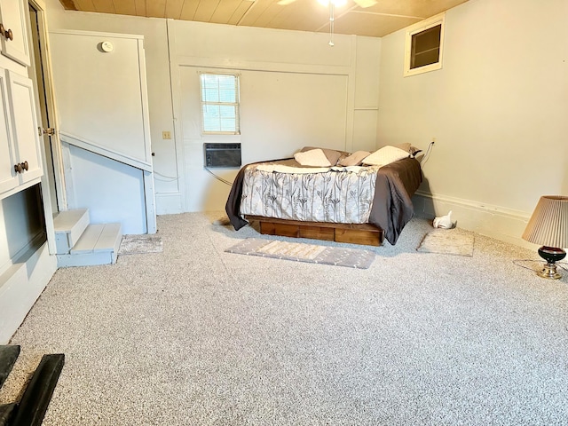 bedroom with cooling unit, wood ceiling, and carpet