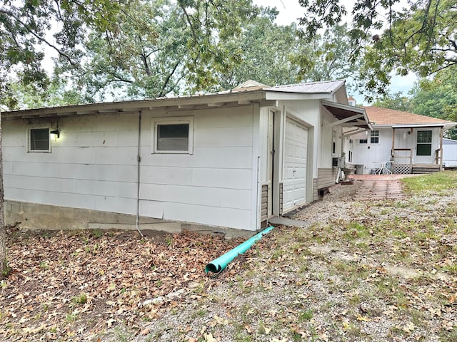 view of side of property with a garage