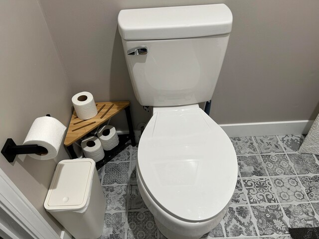 bathroom featuring tile patterned flooring and toilet