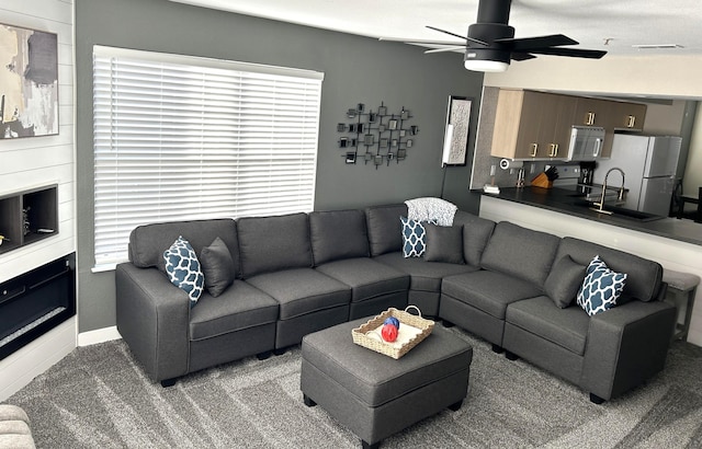 200 Meadow Ridge Ln Unit 6-2, Branson, MO 65616 - living room featuring a ceiling fan, baseboards, and carpet