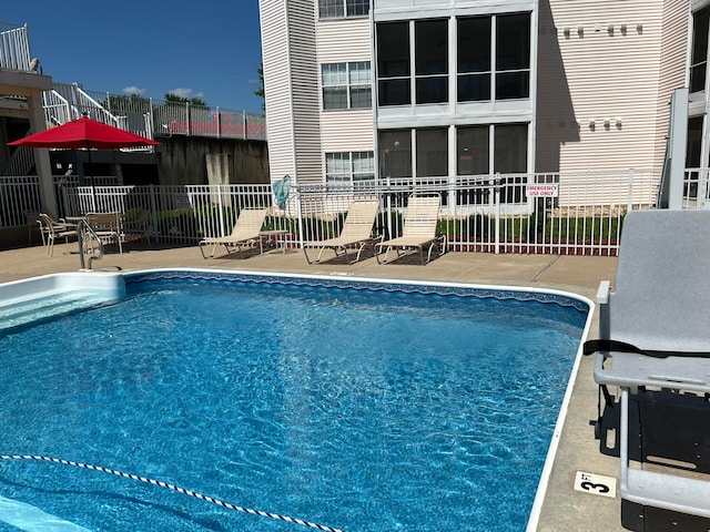 view of swimming pool featuring a patio