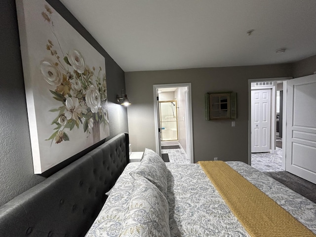 200 Meadow Ridge Ln Unit 6-2, Branson, MO 65616 - bedroom with baseboards, carpet flooring, and connected bathroom