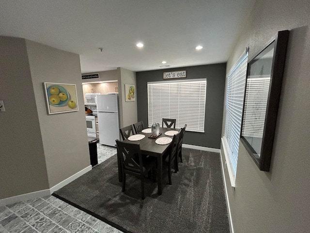 view of carpeted dining room