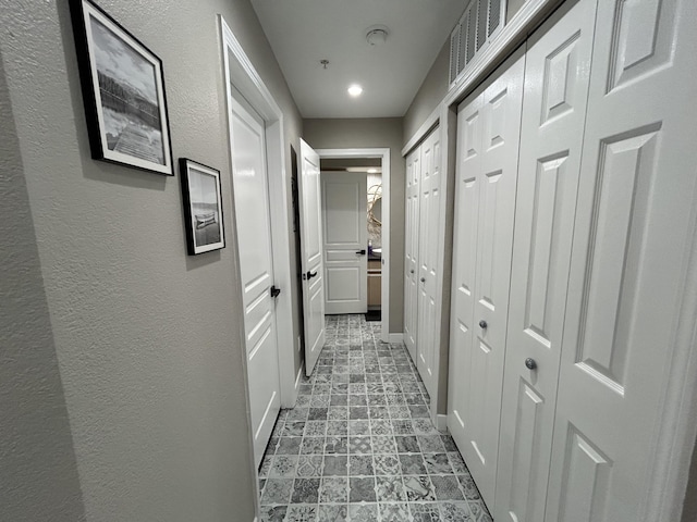 200 Meadow Ridge Ln Unit 6-2, Branson, MO 65616 - hallway with baseboards and a textured wall