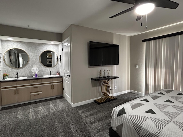 200 Meadow Ridge Ln Unit 6-2, Branson, MO 65616 - bedroom with dark colored carpet, baseboards, ceiling fan, and a sink