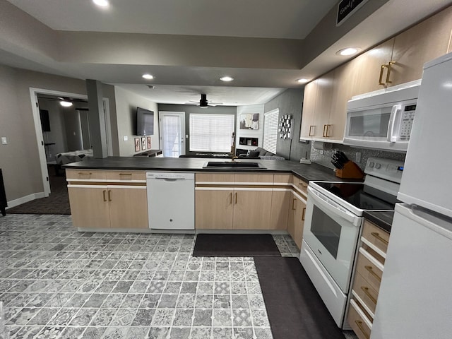 kitchen featuring ceiling fan, light brown cabinets, kitchen peninsula, and white appliances