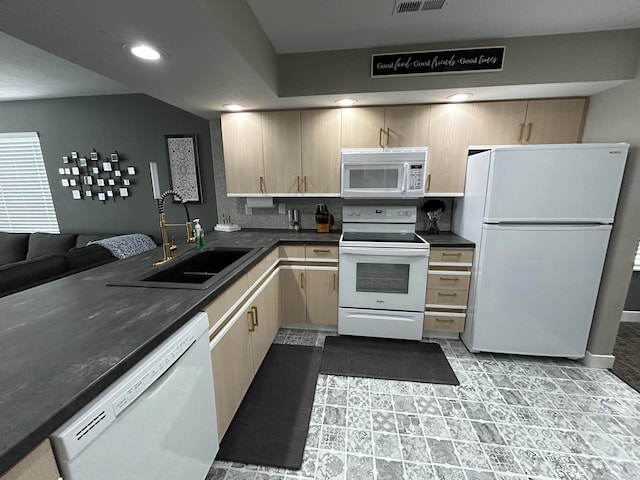 200 Meadow Ridge Ln Unit 6-2, Branson, MO 65616 - kitchen featuring dark countertops, light brown cabinets, white appliances, and a sink