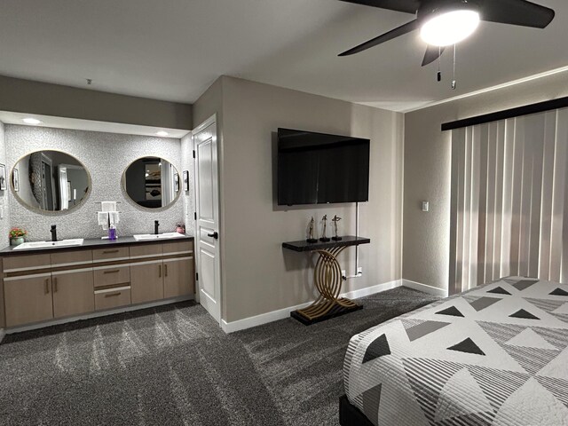 200 Meadow Ridge Ln Unit 6-2, Branson, MO 65616 - bedroom with dark colored carpet, baseboards, ceiling fan, and a sink