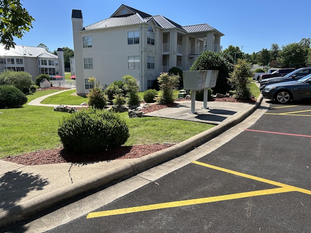 200 Meadow Ridge Ln Unit 6-2, Branson, MO 65616 - exterior space featuring uncovered parking, a yard, and mail area