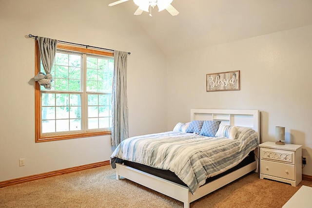 carpeted bedroom featuring lofted ceiling and ceiling fan