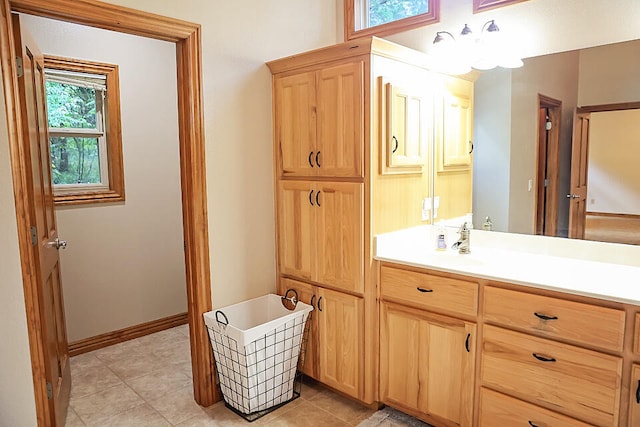 bathroom featuring tile patterned flooring, plenty of natural light, and vanity