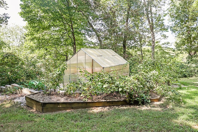 view of outbuilding with a yard