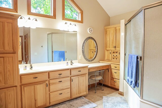 bathroom featuring shower / bath combination with glass door, vanity, lofted ceiling, and tile patterned floors