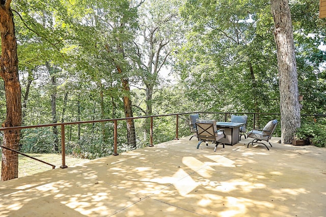 view of patio with an outdoor fire pit