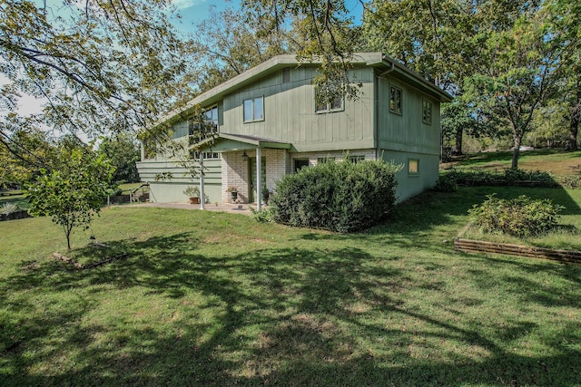 28409 Bali Rd, Warsaw, MO 65355 - exterior space featuring a front yard and brick siding