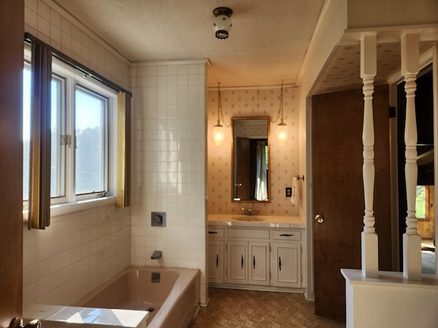 28409 Bali Rd, Warsaw, MO 65355 - bathroom with tile patterned flooring, vanity, a textured ceiling, and a garden tub