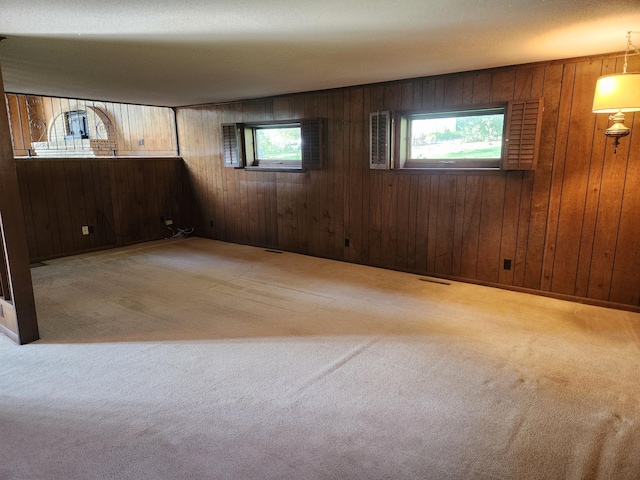 28409 Bali Rd, Warsaw, MO 65355 - empty room featuring wood walls, visible vents, and carpet floors