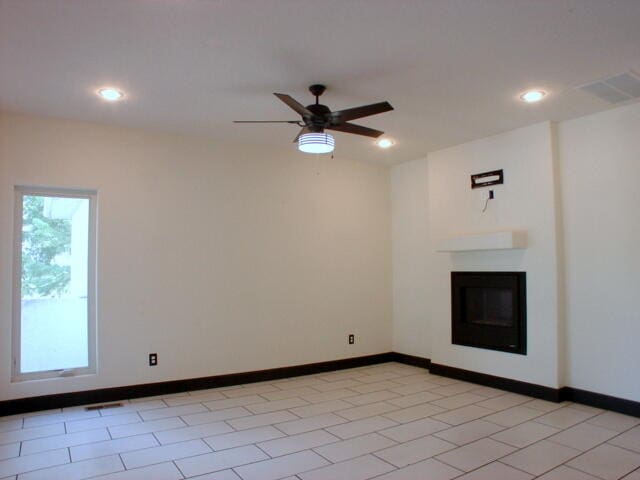 tiled empty room with ceiling fan