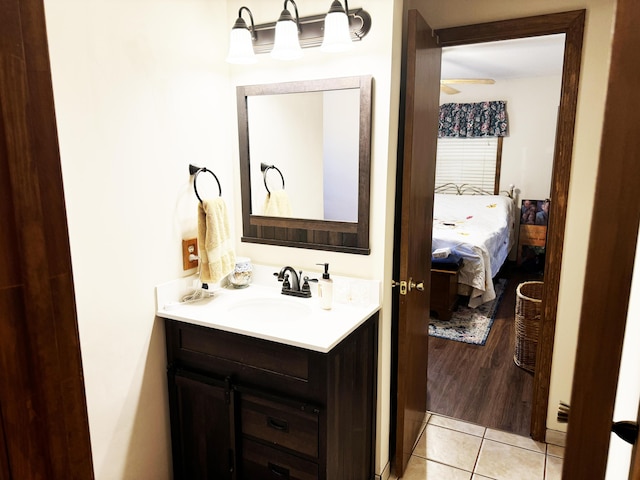 10520 County Road 237, Warsaw, MO 65355 - bathroom featuring ceiling fan, vanity, and tile patterned floors