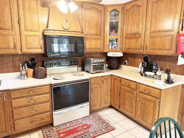 kitchen featuring ceiling fan, white electric range, and light tile patterned floors