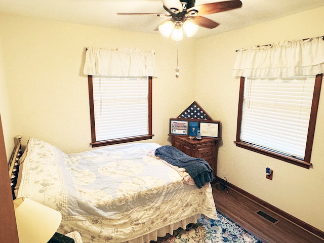 bedroom featuring hardwood / wood-style flooring and ceiling fan