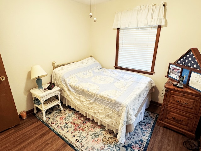 bedroom featuring dark hardwood / wood-style floors