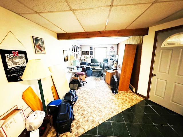 tiled home office with a paneled ceiling