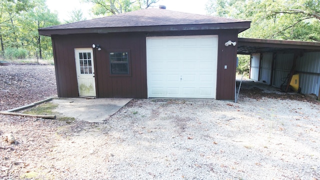 garage featuring a carport