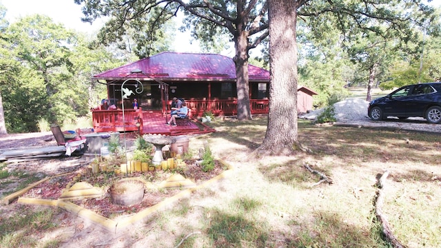 10520 County Road 237, Warsaw, MO 65355 - back of property with metal roof and a deck