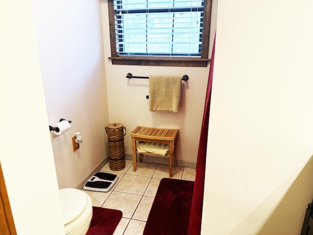 10520 County Road 237, Warsaw, MO 65355 - bathroom featuring toilet, tile patterned floors, and baseboards