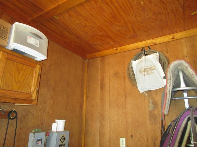 room details featuring wood walls and wood ceiling