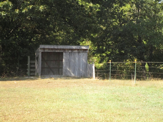 view of pole building with a yard