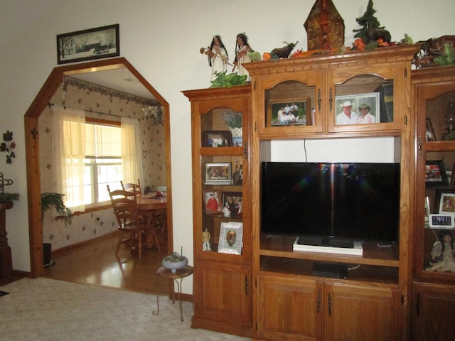 living area featuring wood finished floors and baseboards