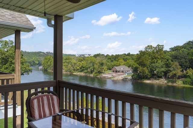 wooden terrace with a water view