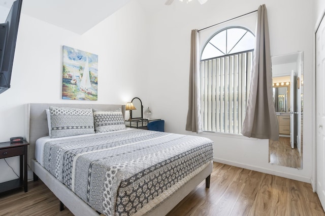 bedroom with wood-type flooring and ceiling fan