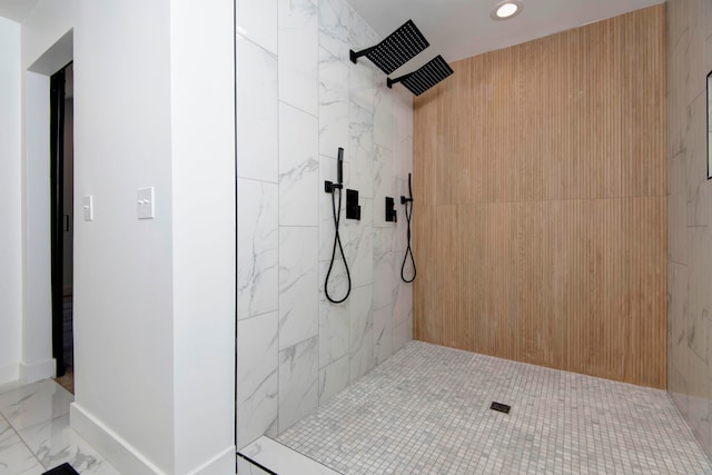 bathroom with a tile shower