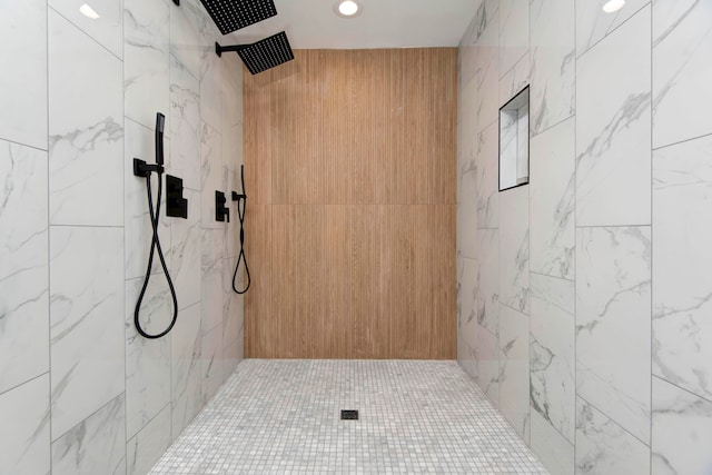 bathroom with tiled shower