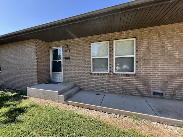 328 E 4th St, Willow Springs, MO 65793 - property entrance with brick siding and crawl space