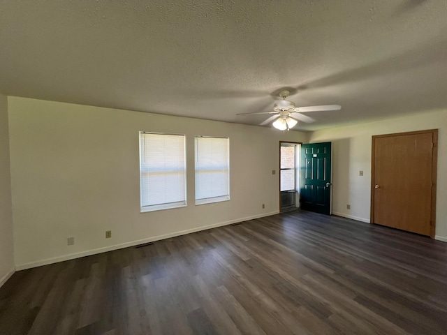 unfurnished bedroom with ceiling fan, a textured ceiling, and dark hardwood / wood-style floors