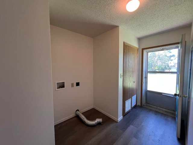 laundry area featuring washer hookup, dark hardwood / wood-style flooring, and a textured ceiling