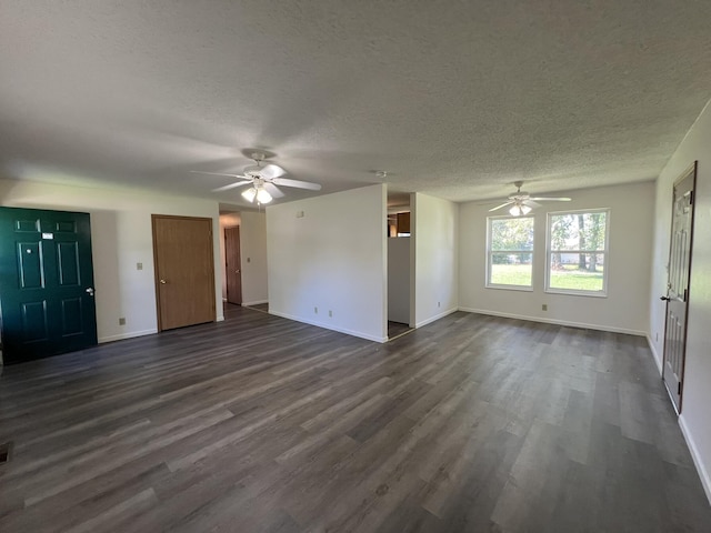328 E 4th St, Willow Springs, MO 65793 - unfurnished living room with ceiling fan, baseboards, a textured ceiling, and dark wood-style floors